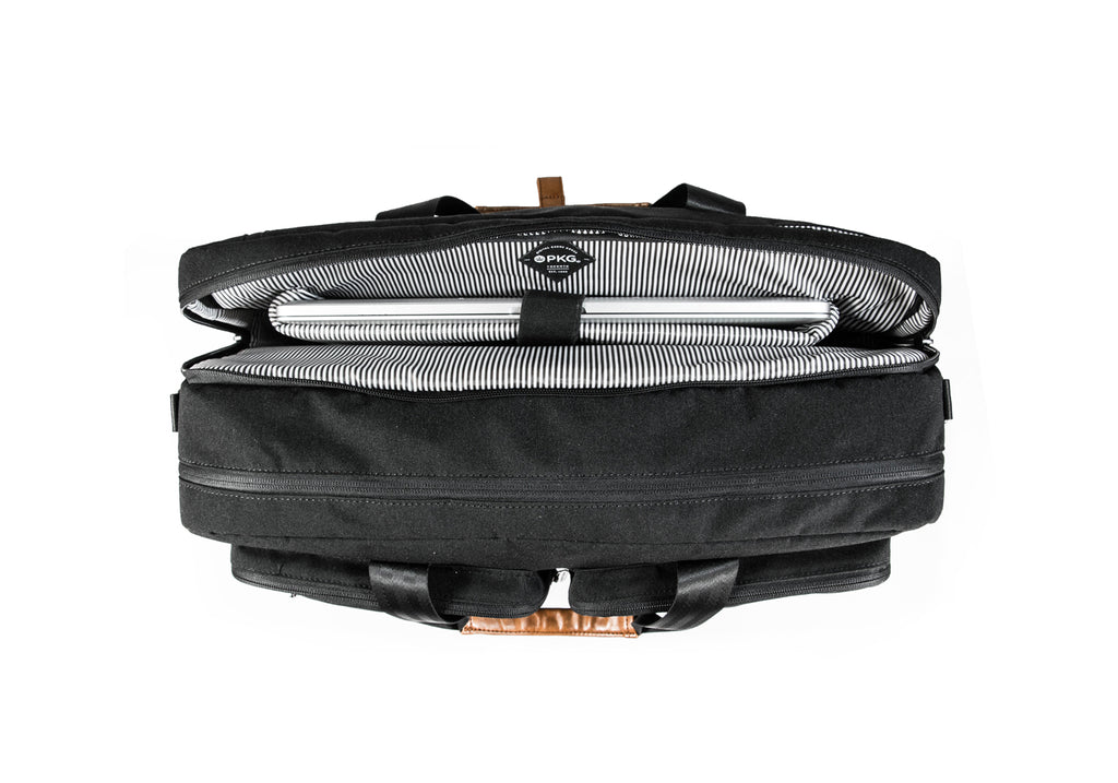 PKG Trenton 31L Messenger Bag (black) showing open business compartment with dedicated laptop pocket