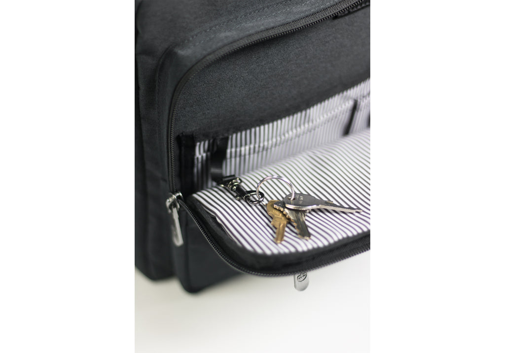 PKG Trenton 31L Messenger Bag (dark grey) detailed view of secure keychain clip inside front pocket