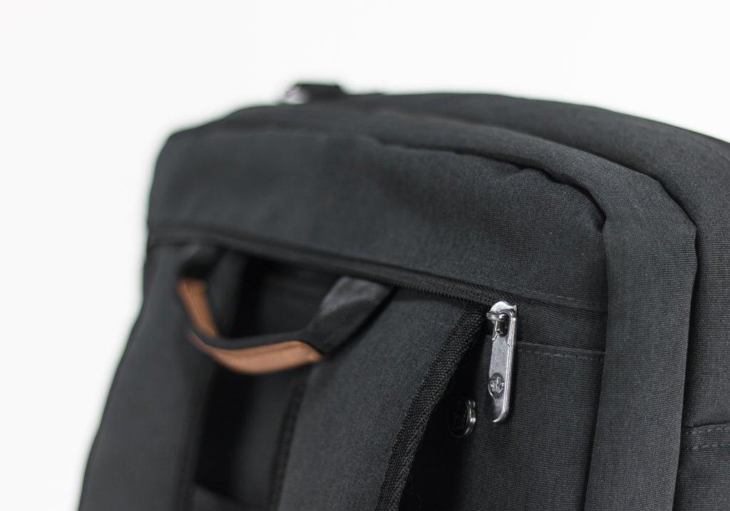 PKG Trenton 31L Messenger Bag (dark grey) detailed view of backpack style straps coming out of dedicated compartment 