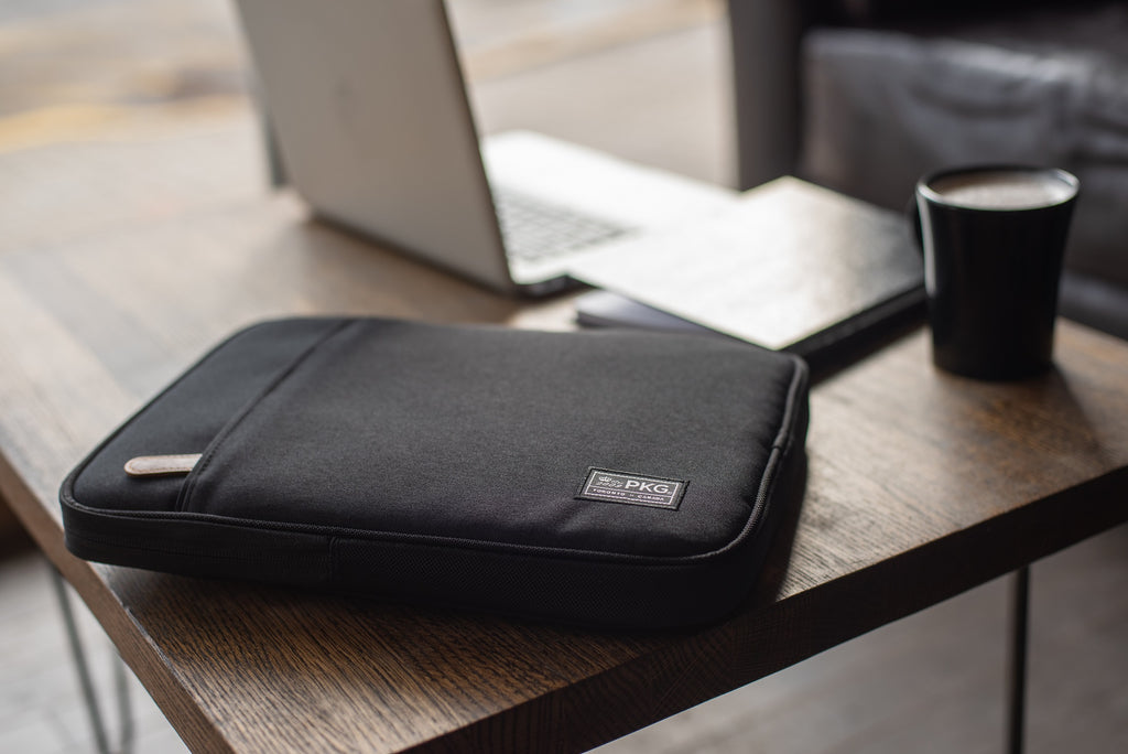PKG Stuff Recycled Laptop Sleeve (black) resting on table